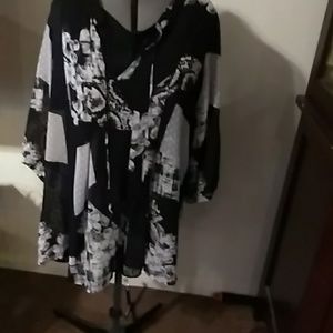 A white and black tunic with a black shell.